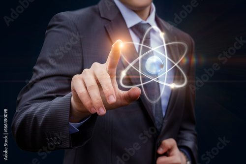 Businessman touches of the atom .