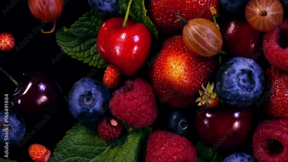 Fresh juicy berries in 4K. Extreme closeup rotation of mixed tasty fruits.
Fresh juicy berries in 4K. Extreme closeup rotation of mixed tasty fruits.