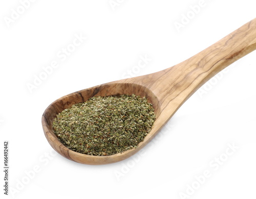 Dry marjoram in wooden spoon isolated on white background