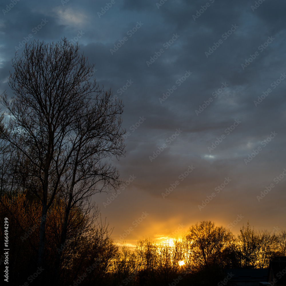 Fototapeta premium Storm clouds and sunset