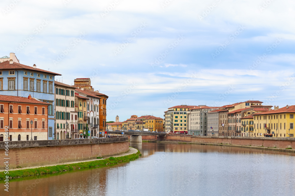 Riverside buildings at river Arno in Pisa, Italy