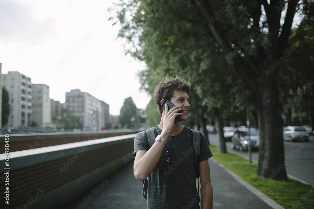 Young man using a smartphone outdoor Young man using a smartphone outdoor
