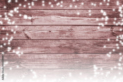 Snowfall and old boards. Snow-covered christmas background.