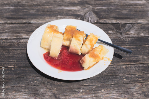 фотографія Traditional Slovene Struklji with strawberry jam an white plate,