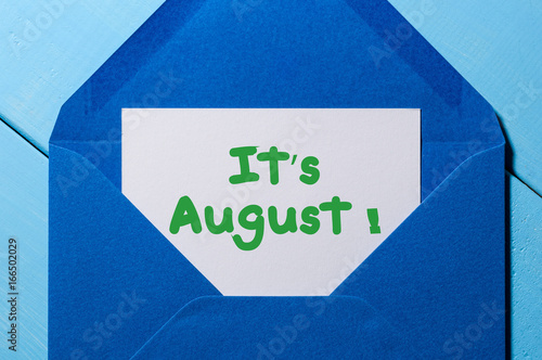 It's August text in message at blue envelope photo