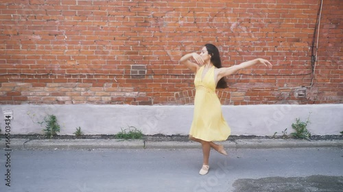 Ballerina dancing in an alley