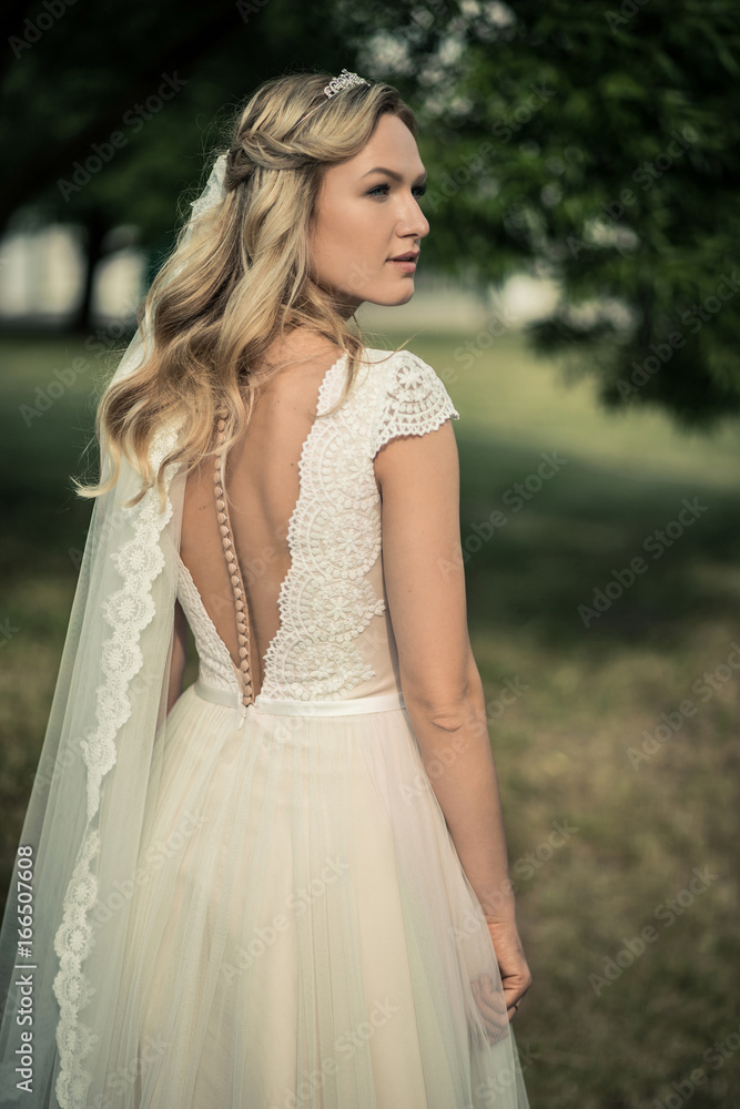 Beautiful bride outdoors in a forest. Beautiful bride outdoors in a forest.