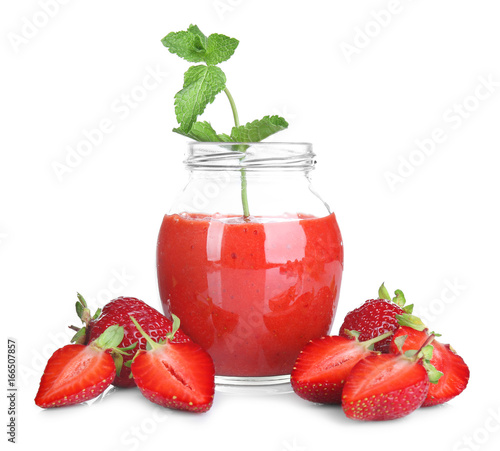 Jar of delicious strawberry homemade smoothie on white background