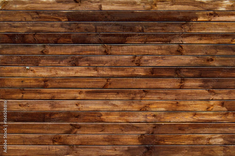 Naklejka premium Background of natural knotted wood fence. Wooden texture.