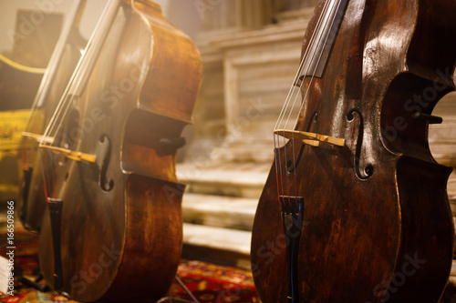 Cello orchestra musical instruments closeup on black photo