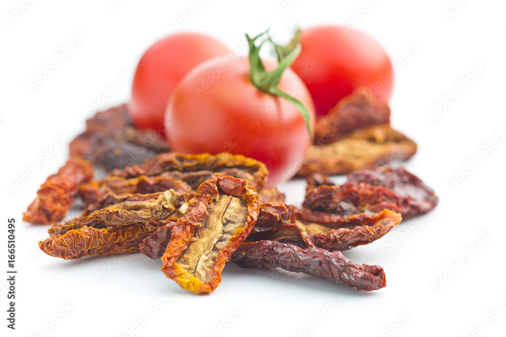 Dried sliced tomatoes and fresh tomatoes. Dried sliced tomatoes and fresh tomatoes.