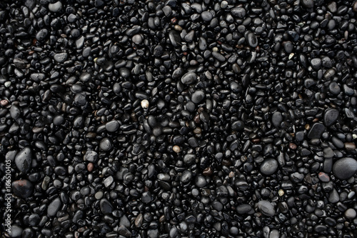 Bilde på lerret Black pebbles on the black stone beach, Vik, Iceland