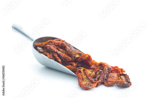 Dried sliced tomatoes in scoop. photo