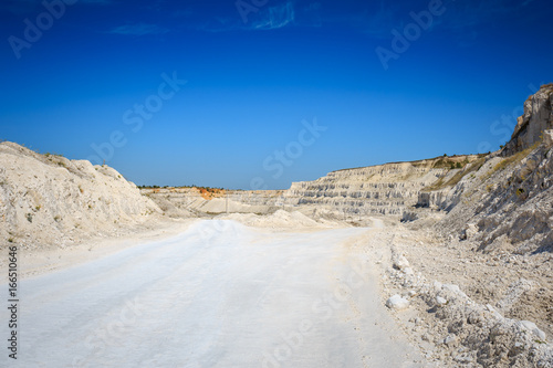 Road to quarry. Limestone mining. White rocks