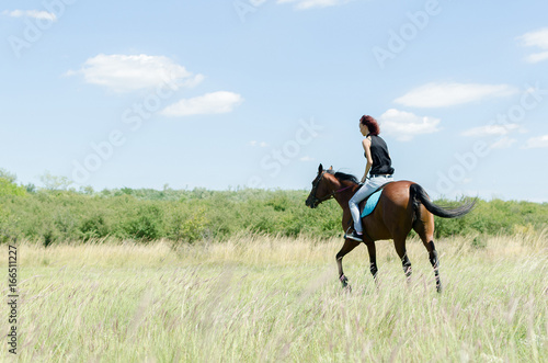 woman on the horse bac view © focusandblur