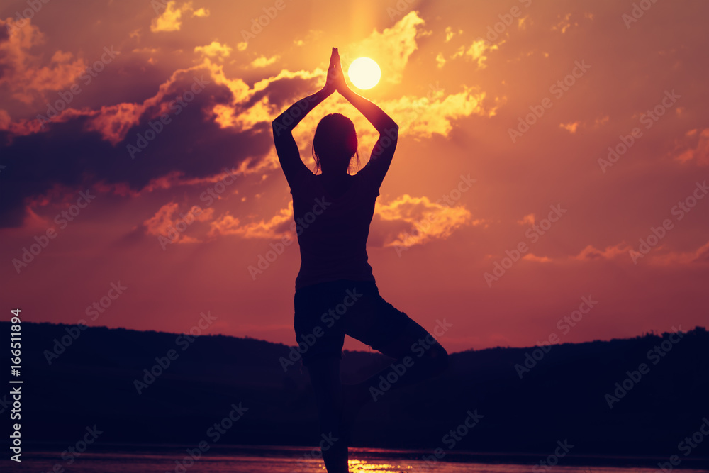 Sunset yoga woman meditation