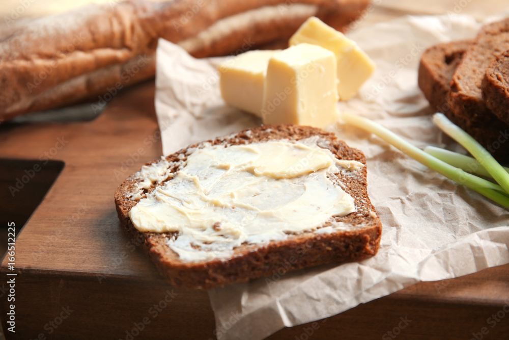 Delicious toast and butter on cutting board Delicious toast and butter on cutting board
