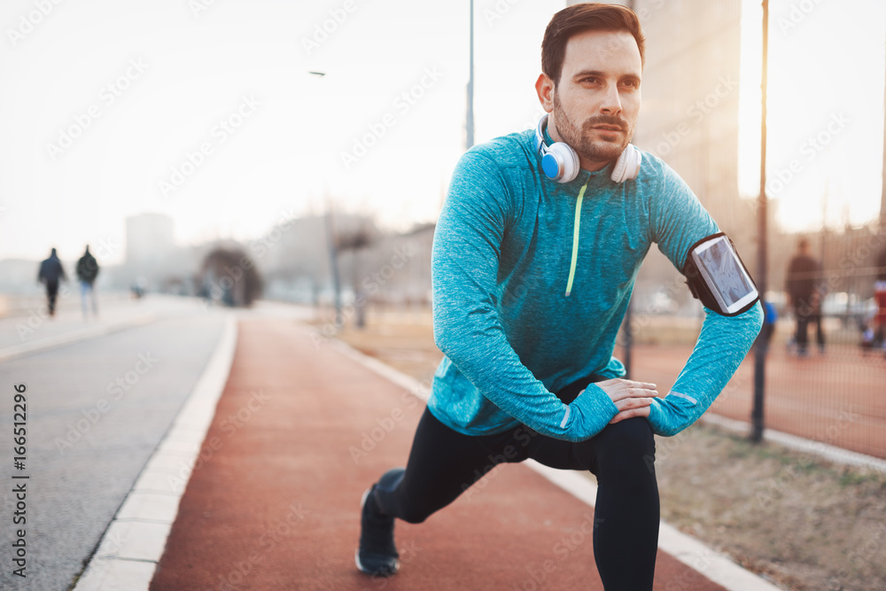 Handsome healthy sportsman exercising Handsome healthy sportsman exercising