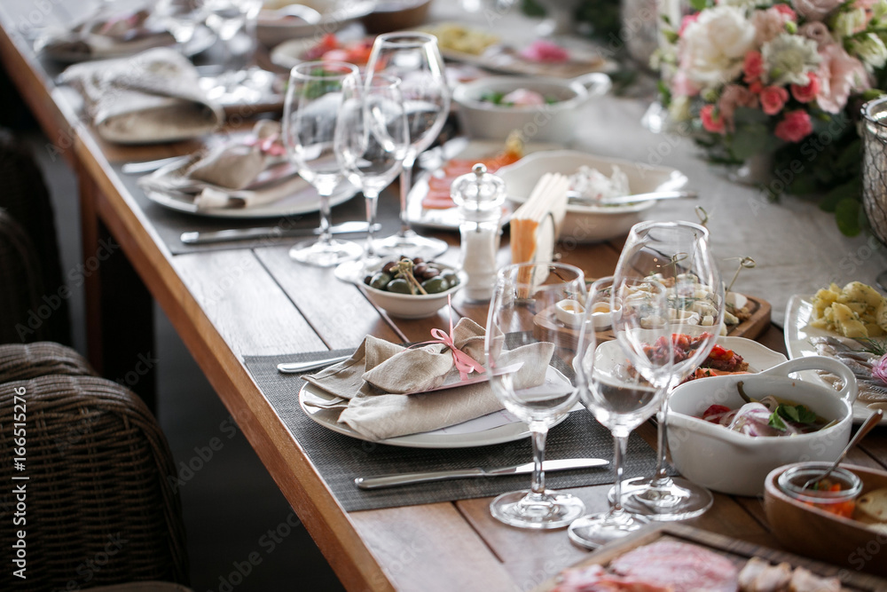 linen textile. Decorated table, a plate of neatly arranged napkin, fork and knife.