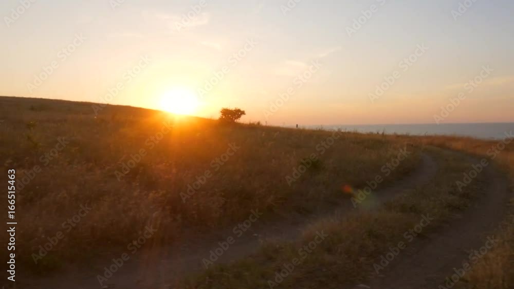 Window View from Car on Sea Shore and Amazing Golden Sunset. Traveling Offroad Lifestyle HD Slowmotion Footage. Crimea, Russia. Window View from Car on Sea Shore and Amazing Golden Sunset. Traveling Offroad Lifestyle HD Slowmotion Footage. Crimea, Russia.