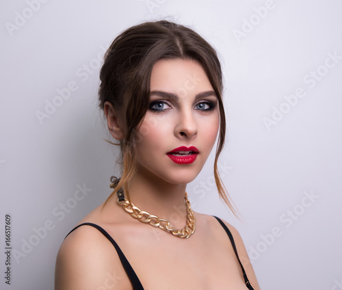 Fashionable portrait of a girl model. Fashion, accessories, evening makeup. 