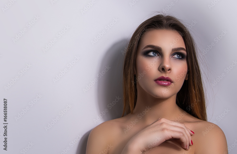 Naklejka premium Fashionable portrait of a girl model. Fashion, smoky eyes makeup.