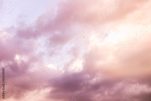 Pink Fluffy Clouds on Bright Sky