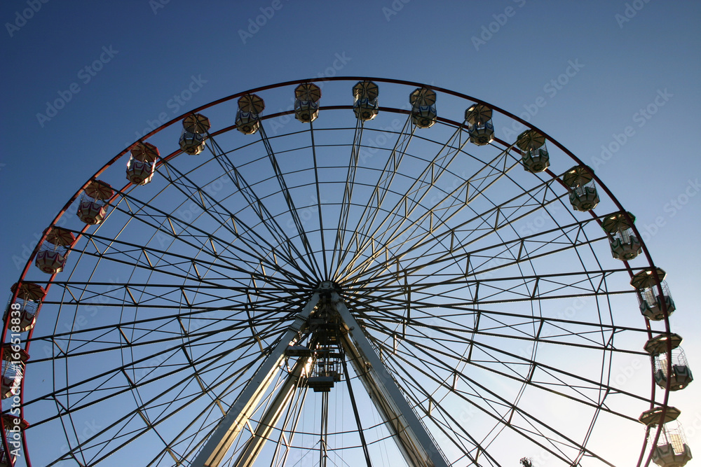A giant wheel in the sky at a carnival in Cardiff, Wales