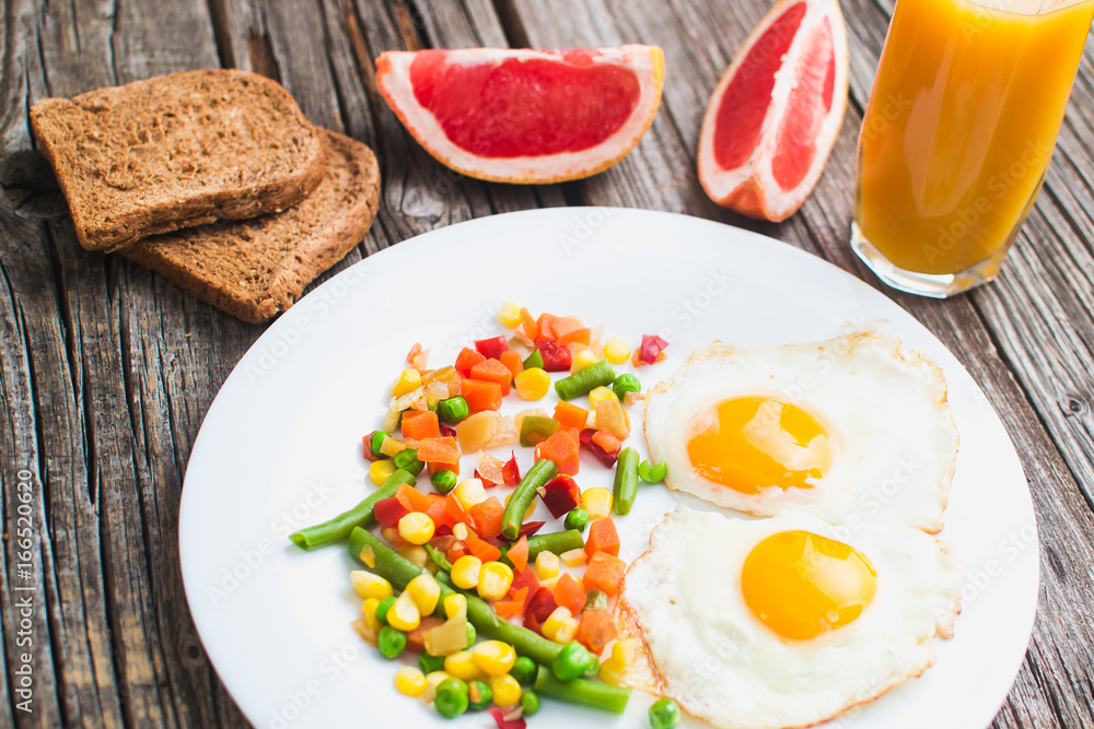 Breakfast on the wooden background from chicken breast Breakfast on the wooden background from chicken breast