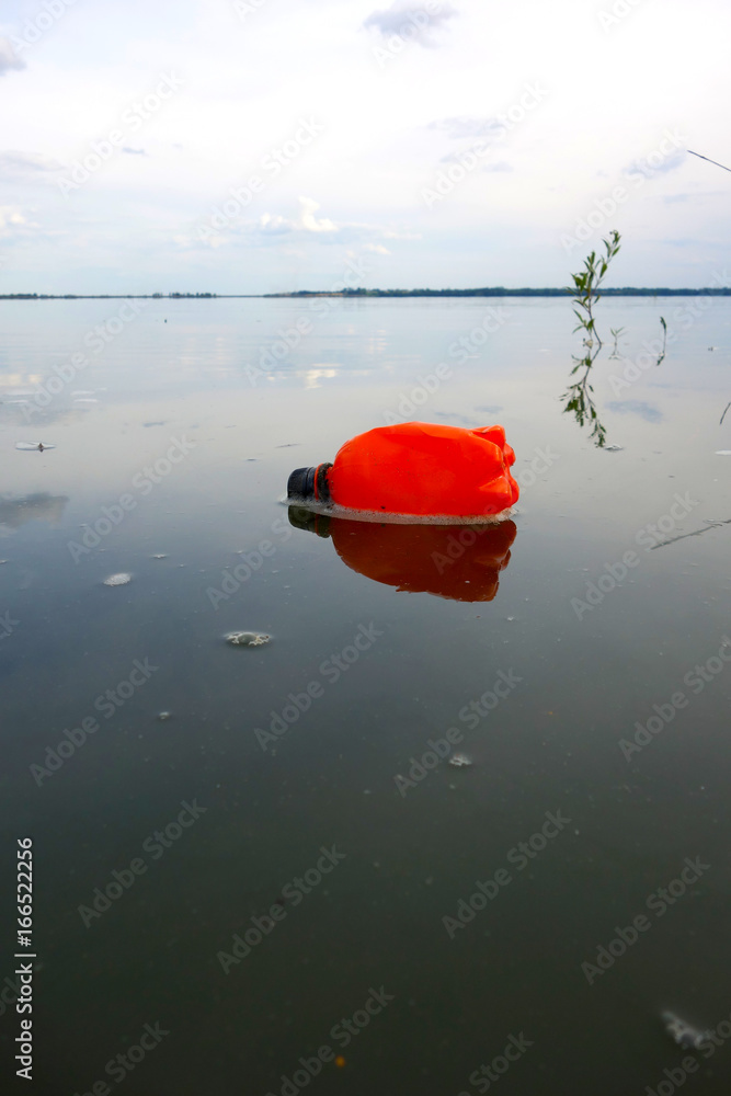 Plastic bottle floating on the surface of the lake Plastic bottle floating on the surface of the lake