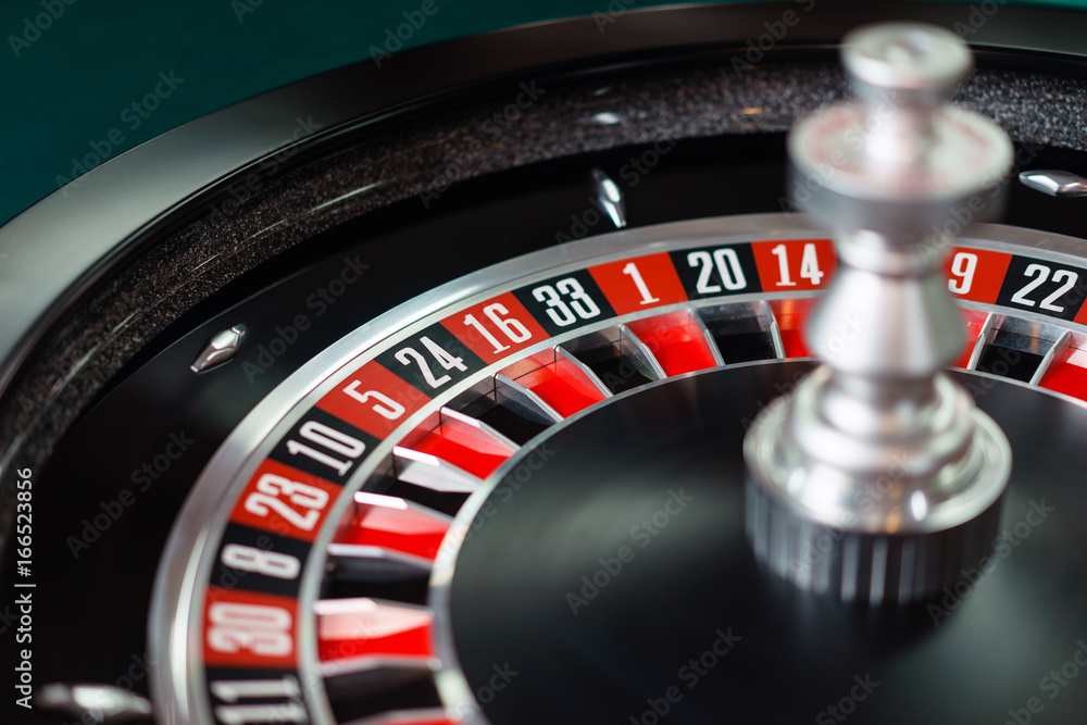 Casino roulette wheel and it's numbers in red and black color Casino roulette wheel and it's numbers in red and black color