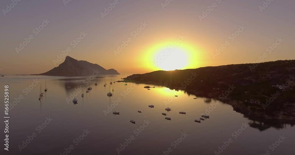 Aerial, beautiful bay in Sardinia with the view on Tavolara island on sunrise, 4K Aerial, beautiful bay in Sardinia with the view on Tavolara island on sunrise, 4K