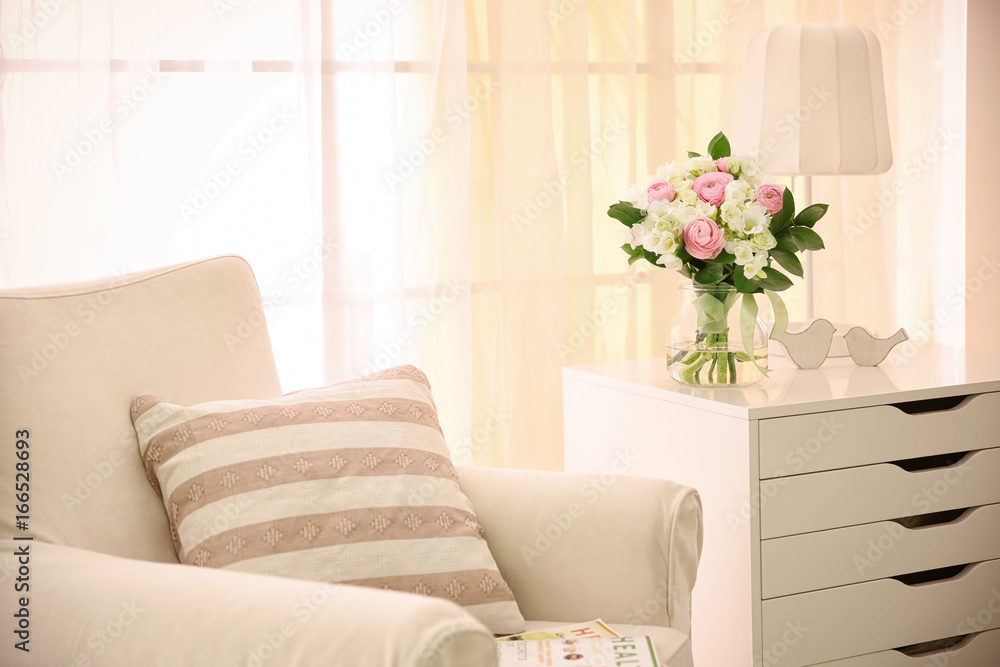 Fototapeta premium Beautiful bouquet with white freesia in modern room interior