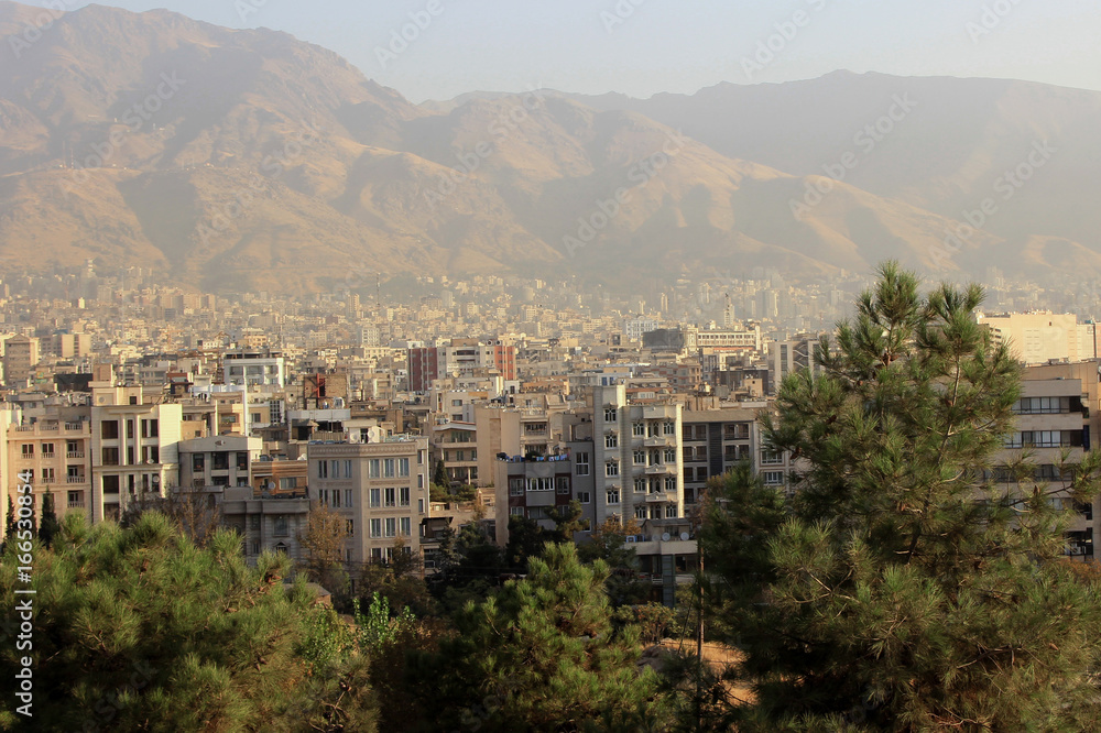 Obraz premium Iran-October 2016 : View of a part of Tehran with office buildings and residences.More than half of Iran's industry is based in Tehran include automobiles,textiles and chemical products.