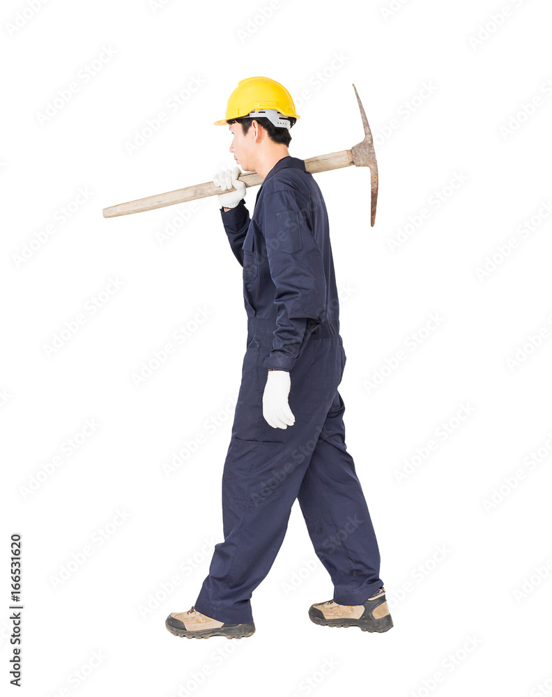 Man in uniform hold old pick mattock that is a mining device Man in uniform hold old pick mattock that is a mining device