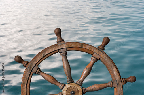 Steering wheel and ocean surface 3d illustration
