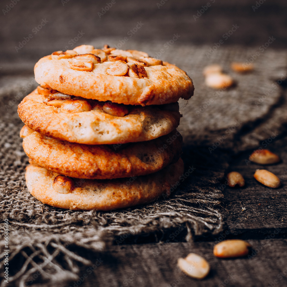 Close up Oatmeal Cookies with peanuts on dark wooden background table. Top view, close up, copy space