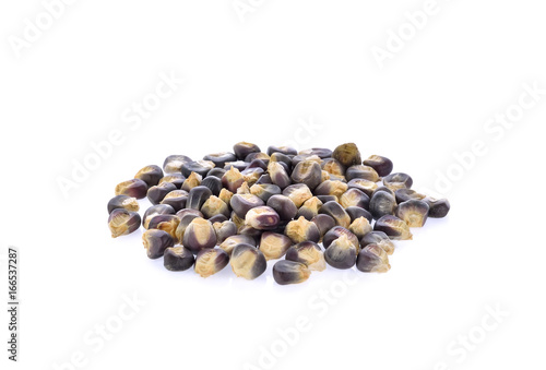 Dried blue corn seeds on white background