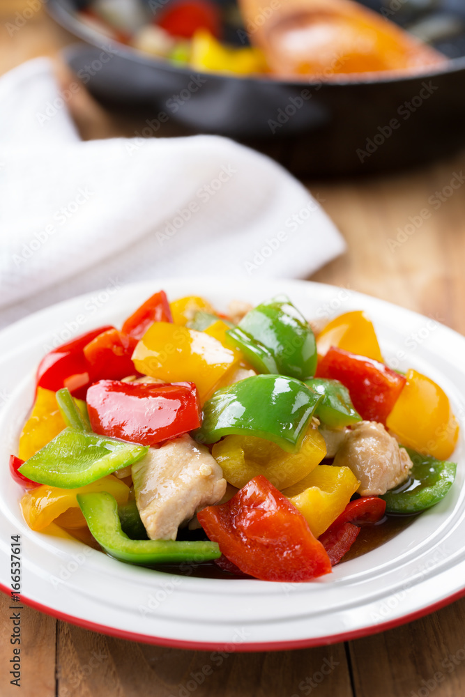 stir fried bell pepper with chicken in plate.