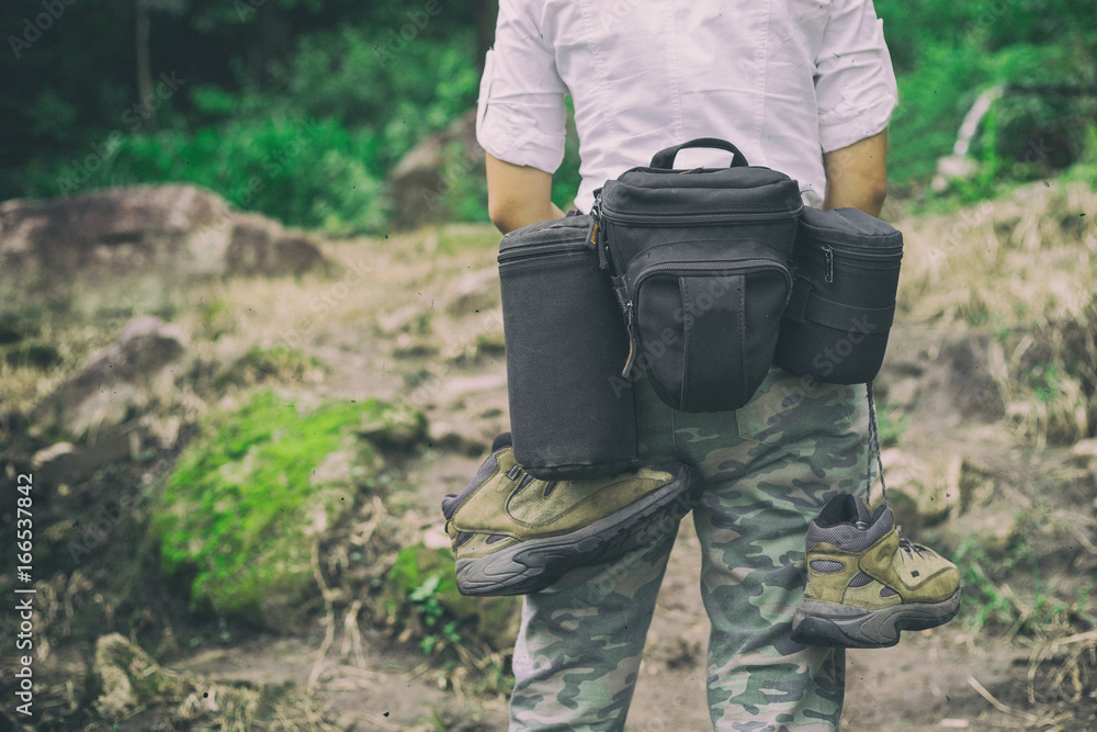 photographer hiking walking with backpack and camera in mountains photographer hiking walking with backpack and camera in mountains