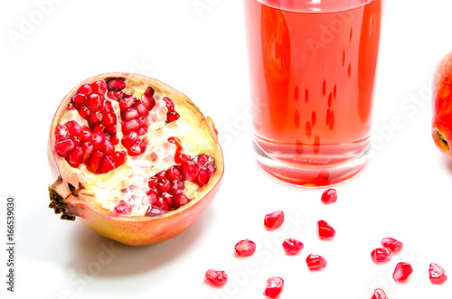 pomepranate juice in glass on white background.Isolated food and drink