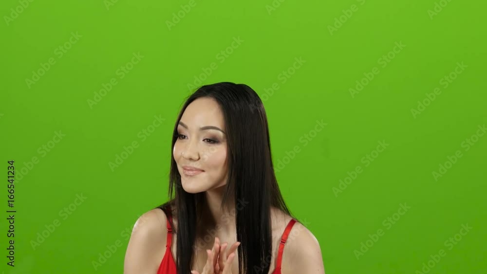 Girl came to the store for shopping and can not choose clothes. Green screen Girl came to the store for shopping and can not choose clothes. Green screen