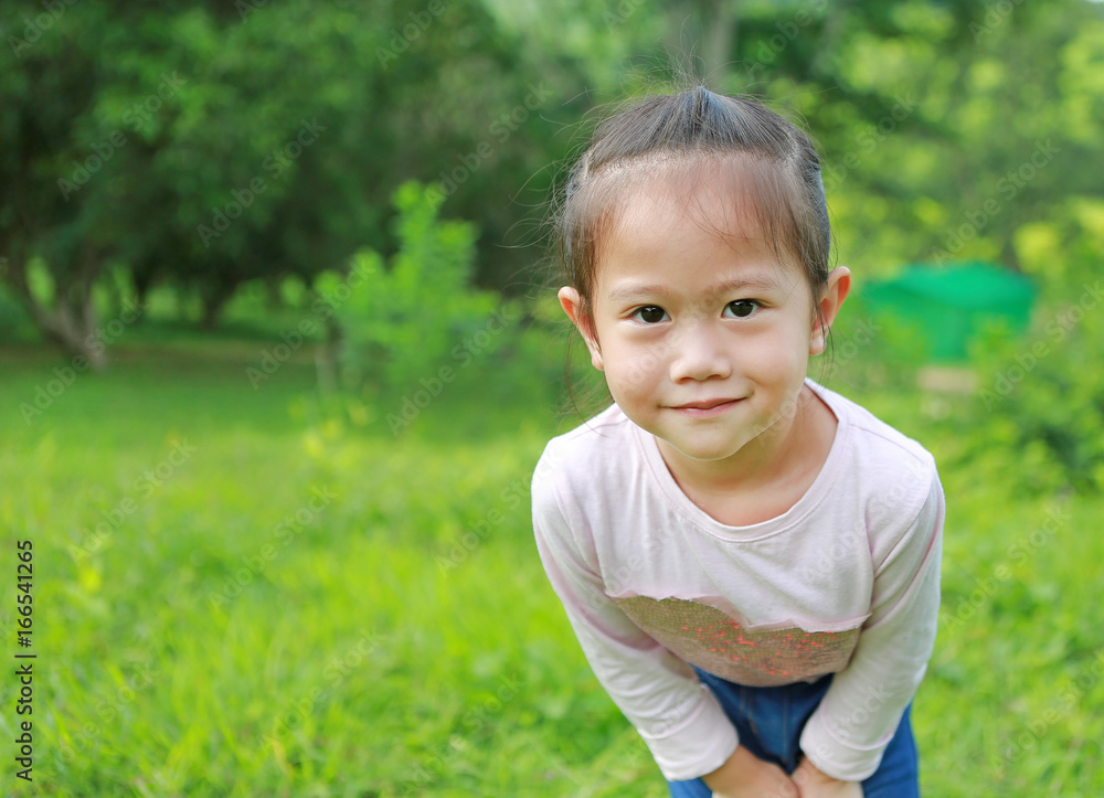 Portrait of little girl posting in the garden. Portrait of little girl posting in the garden.