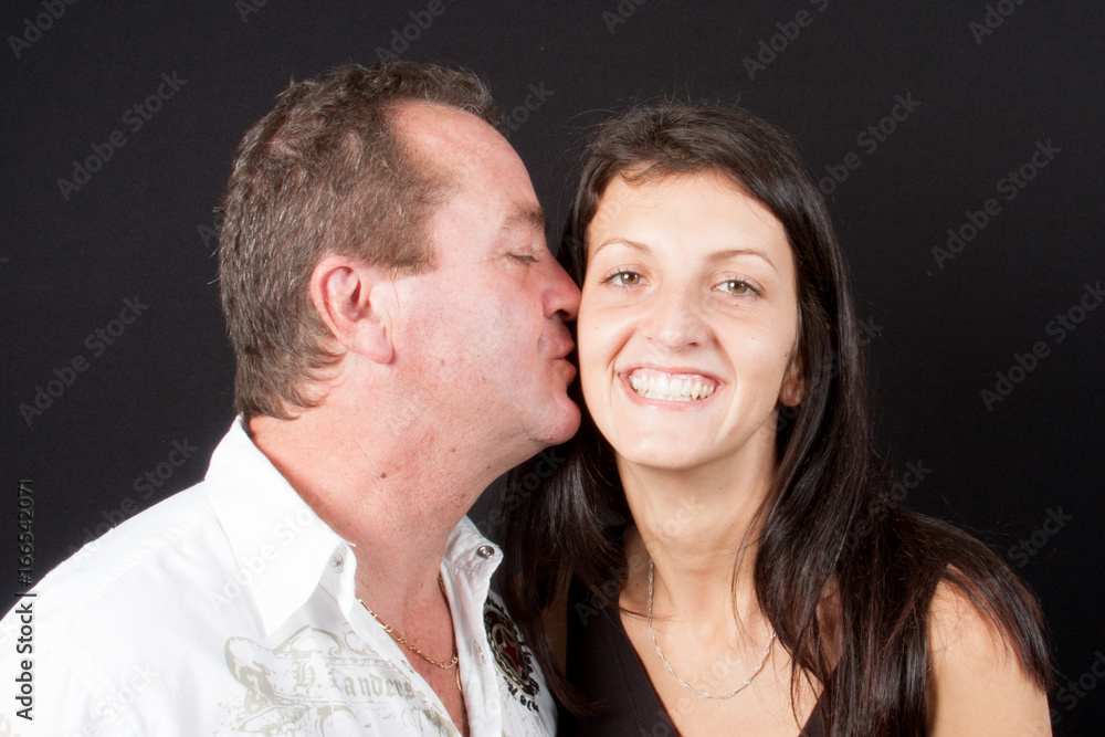 happy father and daughter giving a tenderness hug happy father and daughter giving a tenderness hug