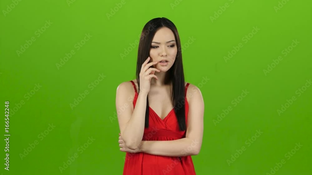 Asian thought about the meaning of life, pensive and focused. Green screen Asian thought about the meaning of life, pensive and focused. Green screen
