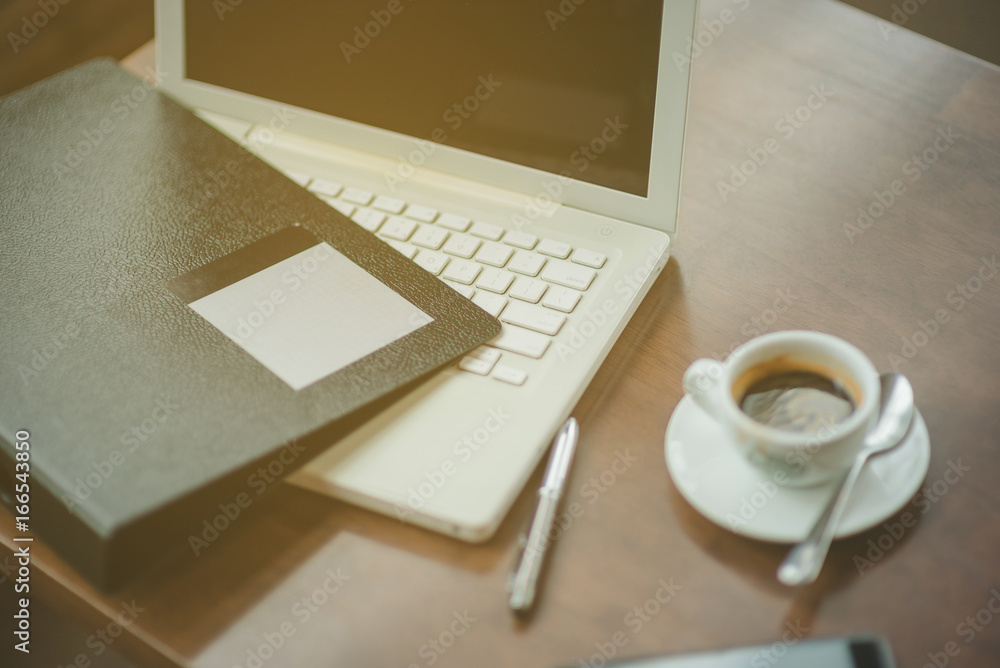 Closeup shot of laptop with digitaltablet and smartphone on desk. Modern devices on desk at office. Three different type of screen to put your responsive web page on. Closeup shot of laptop with digitaltablet and smartphone on desk. Modern devices on desk at office. Three different type of screen to put your responsive web page on.