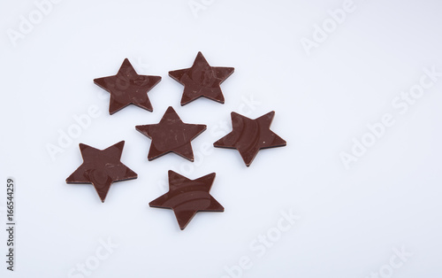 Chocolate or chocolate star on a background.