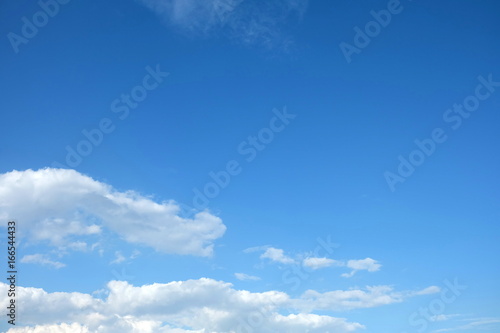 Blue Sky with Clouds Background, Top Space for Text. © mesamong