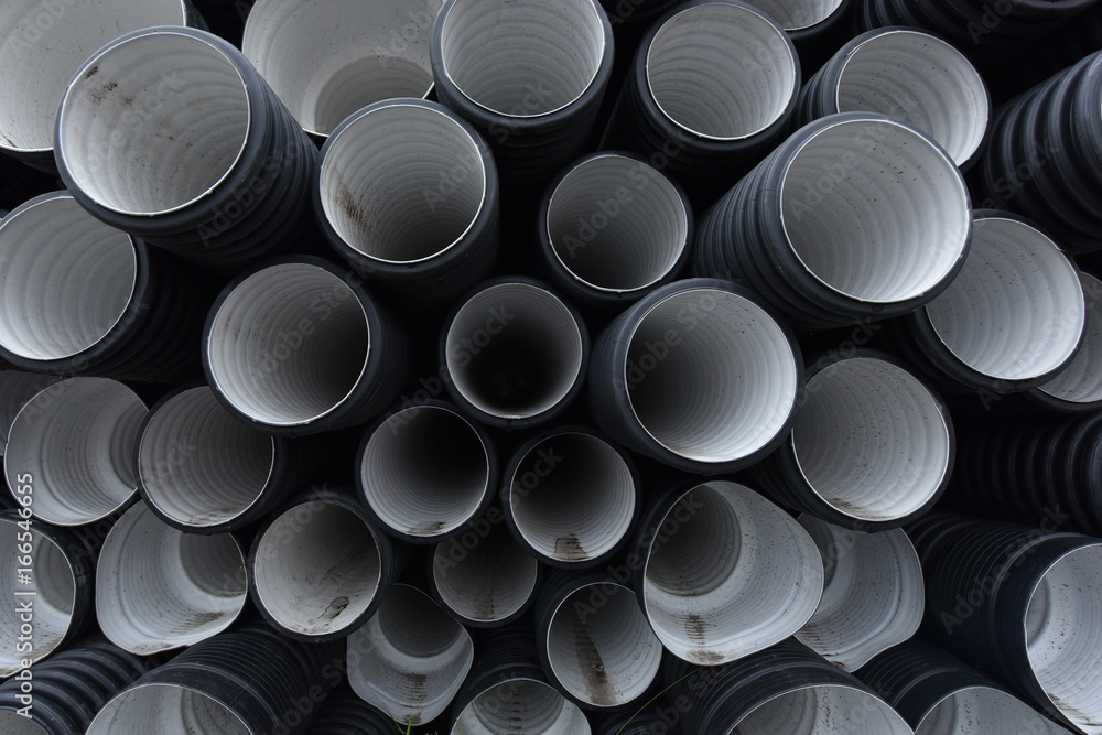 New black-and-white plastic pipes for sewerage system New black-and-white plastic pipes for sewerage system