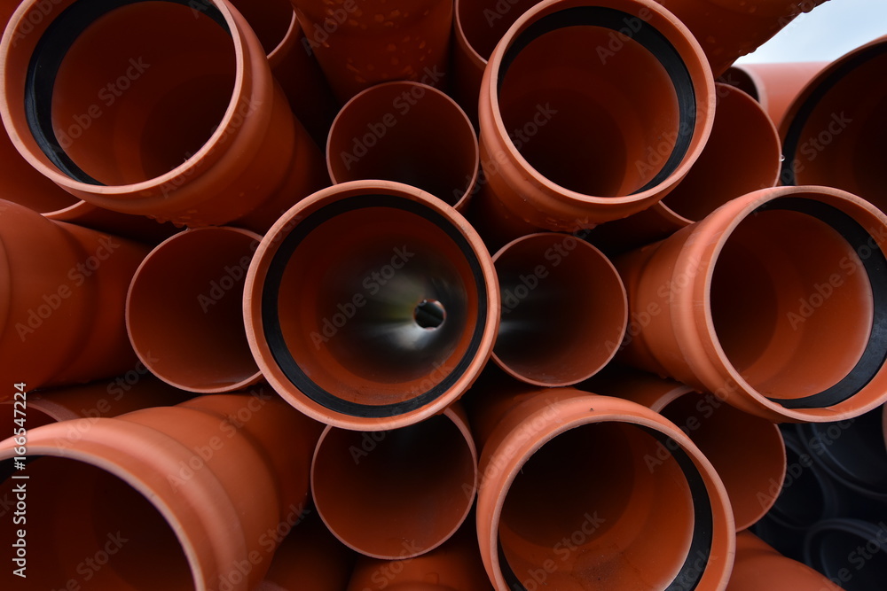 Large orange plastic pipes for sewerage system Large orange plastic pipes for sewerage system